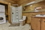 Terrace level bathroom with walk in shower and laundry facility